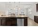 Modern kitchen featuring stainless steel appliances and a granite countertop island at 11841 Thicket Wood Dr, Riverview, FL 33579