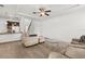 Bright living room featuring a ceiling fan, hardwood floors, and neutral decor at 11841 Thicket Wood Dr, Riverview, FL 33579