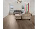 Bright living room with hardwood floors, neutral furniture, and ample natural light at 11841 Thicket Wood Dr, Riverview, FL 33579