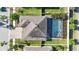 Aerial view of a private home with a screened in pool in a residential neighborhood at 11854 Lake Lucaya Dr, Riverview, FL 33579