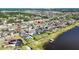 Waterfront homes showcase backyard pools and lush landscaping, blending luxury living with serene water views at 11854 Lake Lucaya Dr, Riverview, FL 33579