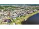 Waterfront homes showcase backyard pools and lush landscaping, blending luxury living with serene water views at 11854 Lake Lucaya Dr, Riverview, FL 33579