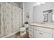 Featuring a bathtub-shower and modern vanity creating a clean and refreshing space at 11854 Lake Lucaya Dr, Riverview, FL 33579
