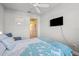 Tranquil bedroom with a comfortable bed, and an open doorway to the bathroom at 11854 Lake Lucaya Dr, Riverview, FL 33579