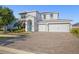 Charming two-story home with a well-manicured lawn, a brick driveway, and a three-car garage at 11854 Lake Lucaya Dr, Riverview, FL 33579