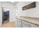 Convenient hallway with built-in cabinets for added storage and organization throughout the home at 11854 Lake Lucaya Dr, Riverview, FL 33579