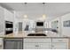 Featuring a kitchen island with seating, creating a cozy and inclusive hub within the home at 11854 Lake Lucaya Dr, Riverview, FL 33579