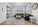 Relaxing living room with large windows, inviting natural light and a view of the private pool at 11854 Lake Lucaya Dr, Riverview, FL 33579