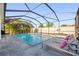 Beautiful pool with a screen enclosure and lounge chairs offers an ideal outdoor living space at 11854 Lake Lucaya Dr, Riverview, FL 33579