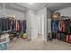 Spacious walk-in closet with plenty of storage and an open doorway to the home at 11854 Lake Lucaya Dr, Riverview, FL 33579