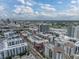 Sprawling aerial view showcasing a dense urban landscape with modern architecture, pools, roadways, and green spaces at 1208 E Kennedy Blvd # 1125, Tampa, FL 33602