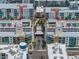 Aerial view of a vibrant residential area with colorful buildings, swimming pools, lush landscaping, and neatly arranged streets at 1208 E Kennedy Blvd # 1125, Tampa, FL 33602