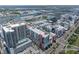 An aerial view highlighting a bustling cityscape with waterfront access and cruise ship terminals at 1208 E Kennedy Blvd # 1125, Tampa, FL 33602