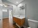 Bathroom with a wooden vanity and a white countertop, offering both functionality and a clean, modern style at 1208 E Kennedy Blvd # 1125, Tampa, FL 33602