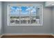 Bright bedroom featuring wood floors, modern finishes, and a large window with city views at 1208 E Kennedy Blvd # 1125, Tampa, FL 33602