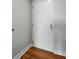 View of a white apartment door with modern hardware against a light gray wall at 1208 E Kennedy Blvd # 1125, Tampa, FL 33602