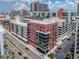 A vibrant city scene featuring modern, colorful apartment buildings and convenient street parking at 1208 E Kennedy Blvd # 1125, Tampa, FL 33602