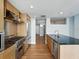 Spacious kitchen featuring stainless steel appliances and an island with sink at 1208 E Kennedy Blvd # 1125, Tampa, FL 33602