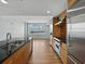 Chef's kitchen featuring stainless appliances, wood cabinets, granite countertops and a spacious layout for cooking at 1208 E Kennedy Blvd # 1125, Tampa, FL 33602
