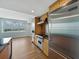 Modern kitchen equipped with stainless steel Viking appliances, wood cabinets, and a bright window at 1208 E Kennedy Blvd # 1125, Tampa, FL 33602
