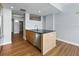 Open concept kitchen with island featuring stainless steel dishwasher and black countertops at 1208 E Kennedy Blvd # 1125, Tampa, FL 33602