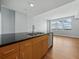 Modern kitchen island with black countertop and stainless steel appliances with city views at 1208 E Kennedy Blvd # 1125, Tampa, FL 33602