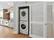 Convenient laundry setup with stacked washer and dryer, perfectly integrated into the modern kitchen space at 1208 E Kennedy Blvd # 1125, Tampa, FL 33602
