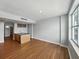 Open concept living room with kitchen island and a large window providing natural light at 1208 E Kennedy Blvd # 1125, Tampa, FL 33602