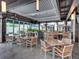 Stylish outdoor seating area with modern tables and chairs, complemented by brick pavers and well-maintained landscaping at 1208 E Kennedy Blvd # 1125, Tampa, FL 33602
