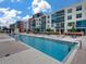 Modern pool with clear blue water, lounge seating, and outdoor dining at 1208 E Kennedy Blvd # 1125, Tampa, FL 33602