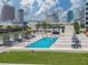 Resort-style pool area offering urban views, comfortable seating, and a relaxing environment at 1208 E Kennedy Blvd # 1125, Tampa, FL 33602