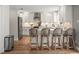 Updated kitchen with counter seating, stainless appliances and modern finishes, perfect for entertaining guests at 12217 Snead Pl, Tampa, FL 33624