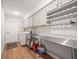 Well lit laundry room with a washer, dryer, cabinets, sink, countertop and wine rack at 12217 Snead Pl, Tampa, FL 33624