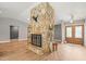 Inviting living room with a stone fireplace and view into the entry foyer at 12217 Snead Pl, Tampa, FL 33624