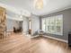 Open-concept living room with plantation shutters, wood floors, and views of the dining room at 12217 Snead Pl, Tampa, FL 33624