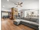 Cozy living room next to a dining area and kitchen with views of the stone fireplace at 12217 Snead Pl, Tampa, FL 33624