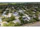 Wonderful aerial view showcases home nestled among lush greenery in a quiet neighborhood at 1326 Moss Dr, Dunedin, FL 34698