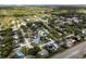 Overhead shot of a charming home surrounded by mature trees in the Dunedin, Florida area at 1326 Moss Dr, Dunedin, FL 34698