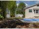The backyard features bamboo, a blue basketball court, and a white vinyl fence at 1326 Moss Dr, Dunedin, FL 34698