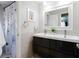 Stylish bathroom with a double sink vanity, modern fixtures, and a clean design, offering a functional and elegant space at 1326 Moss Dr, Dunedin, FL 34698