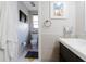 Well-lit bathroom featuring a toilet, vanity, and tasteful decor, designed for convenience and style at 1326 Moss Dr, Dunedin, FL 34698