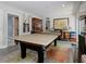 Game room with a ping pong table, a built-in cabinet, and a view into the next room at 1326 Moss Dr, Dunedin, FL 34698