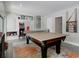Spacious game room featuring a ping pong table, arcade games, and stylish decor at 1326 Moss Dr, Dunedin, FL 34698