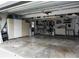 Spacious garage with storage cabinets, bike racks, and ample room for parking and projects at 1326 Moss Dr, Dunedin, FL 34698