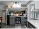 Modern kitchen with a stainless steel beverage cooler, ample counter space, and convenient storage solutions at 1326 Moss Dr, Dunedin, FL 34698