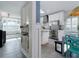 Open kitchen layout with stainless steel appliances and natural light at 1326 Moss Dr, Dunedin, FL 34698