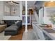 Open-concept space with living room, dining area, and staircase leading to the second floor at 1326 Moss Dr, Dunedin, FL 34698