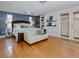 Spacious main bedroom with a sitting area, hardwood floors, and ensuite bath at 1326 Moss Dr, Dunedin, FL 34698