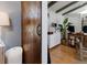View from bedroom looking into a bright office space with a barn door and hardwood floors at 1326 Moss Dr, Dunedin, FL 34698
