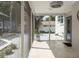 The screened-in patio overlooks the outdoor space that has a basketball court and is perfect for relaxing at 1326 Moss Dr, Dunedin, FL 34698